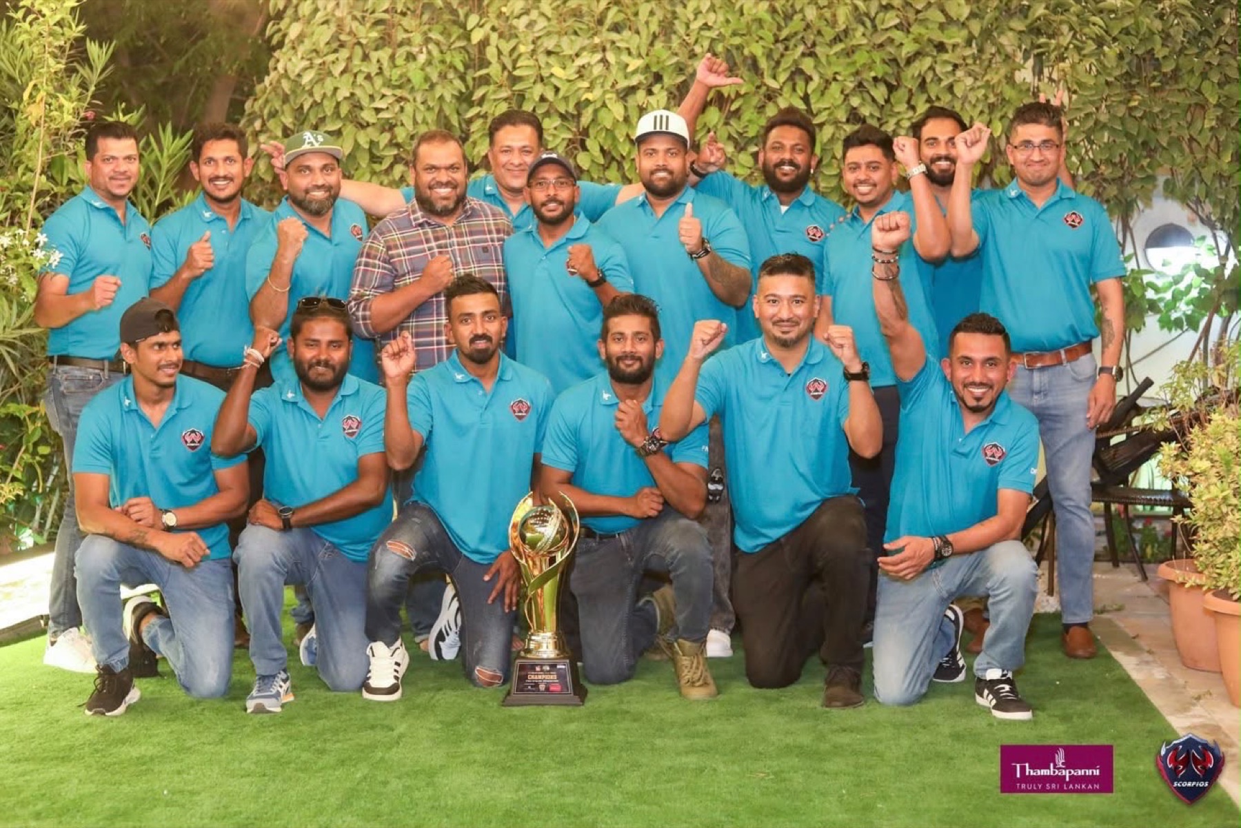 Scorpios Cricket Club members with trophy